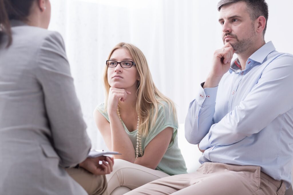 a man and woman speaking to one of the medical professionals at Transformations Treatment Center in Delray Beach, Florida, a leading provider of drug and alcohol abuse treatment