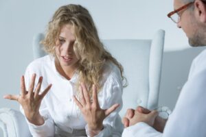 A medical professional prescribing psychiatric medication, a common treatment for disorders like Schizophrenia