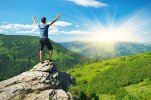 An adventure therapy session, with participants engaging in outdoor activities like rock climbing, to promote mental wellness