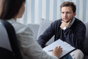 mental health professional helping someone process traumatic memories with trauma-focused treatment